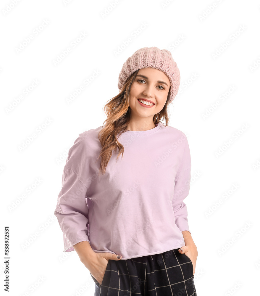 Young woman in warm sweater on white background