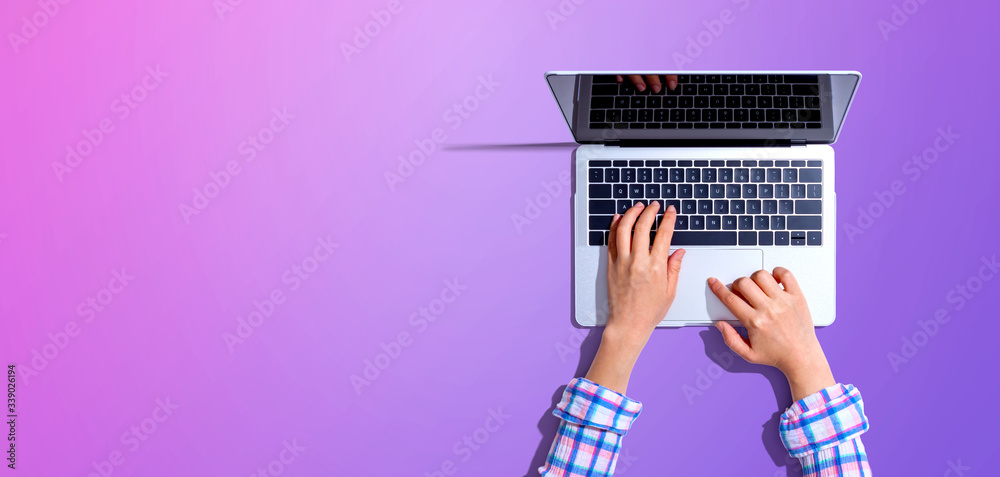 Person using a laptop computer from above