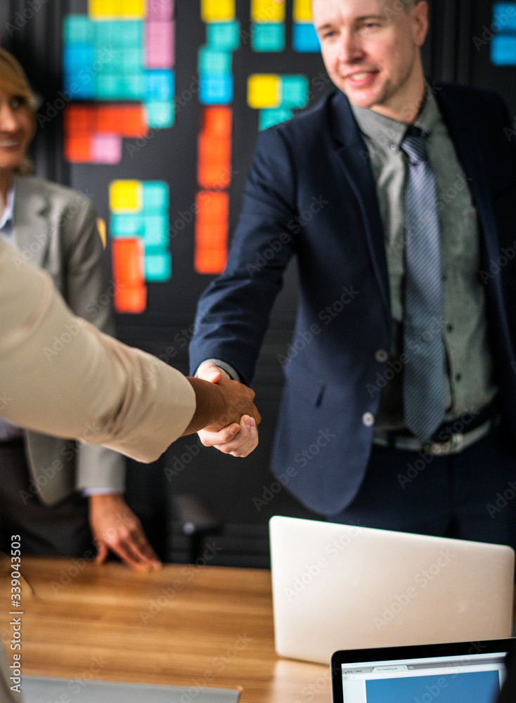 Business people shaking hands in a meeting room