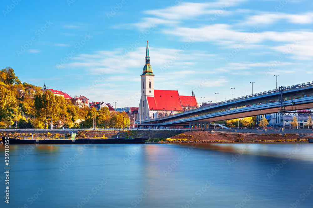 Bratislava castle and Saint Martin Cathedral over Danube river after sunset in the Bratislava old to