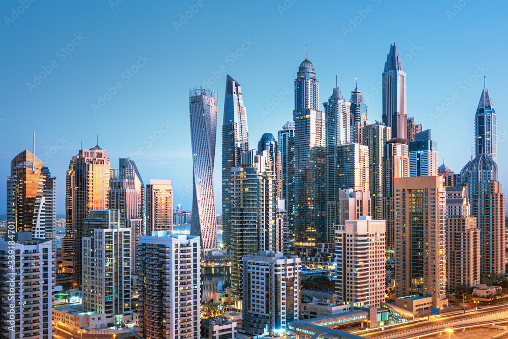 Amazing and Luxury Dubai Marina skyscrapers, famous Jumeirah beach skyscrapers at sunrise, United Ar