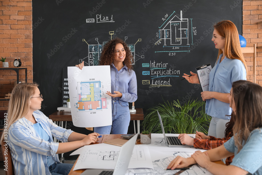 Young architect passing professional exams in office