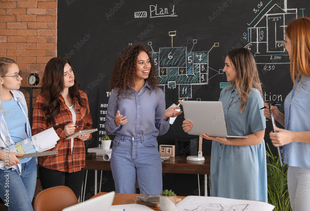 Young architect passing professional exams in office