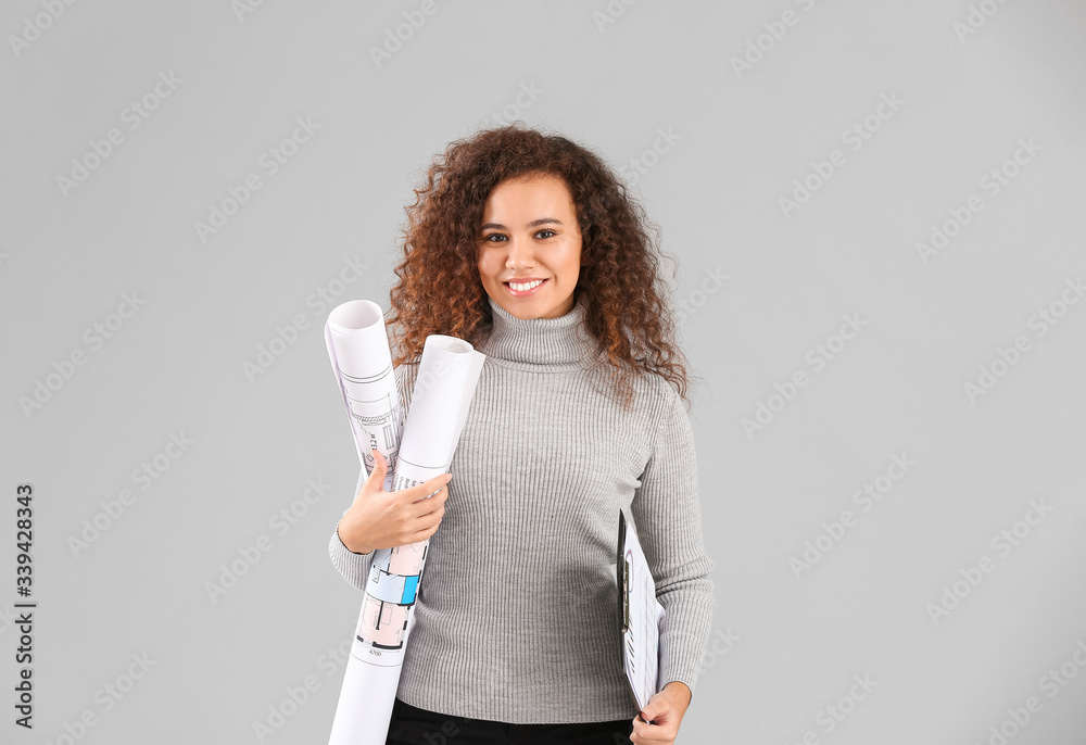 Portrait of architect on grey background