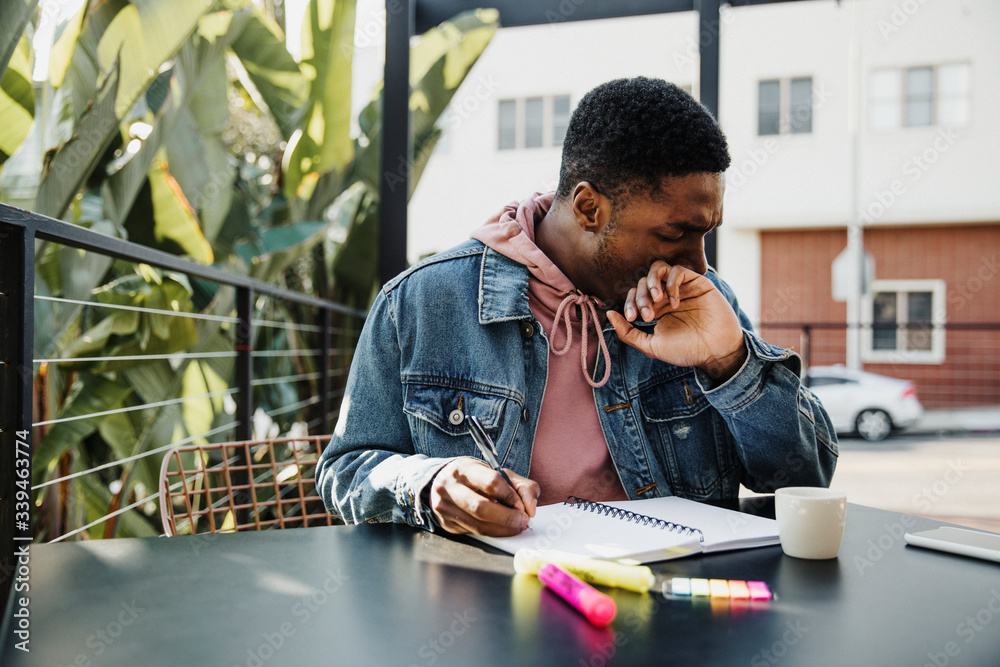 Man writing a note