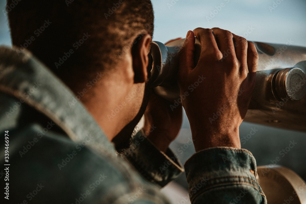 Man using telescope