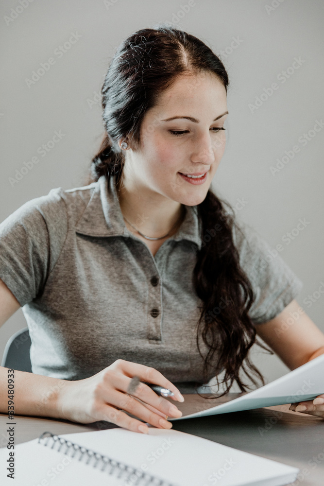 Student reading a note in class