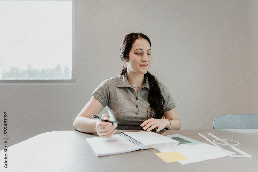 Mathematics student with protractor ruler