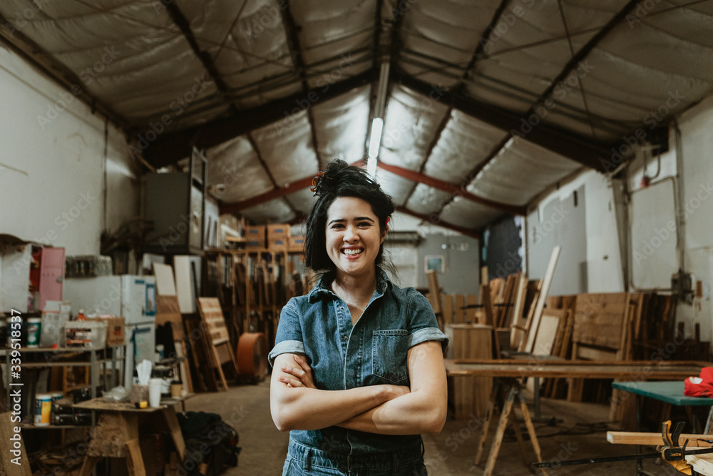 Professional female carpenter posing