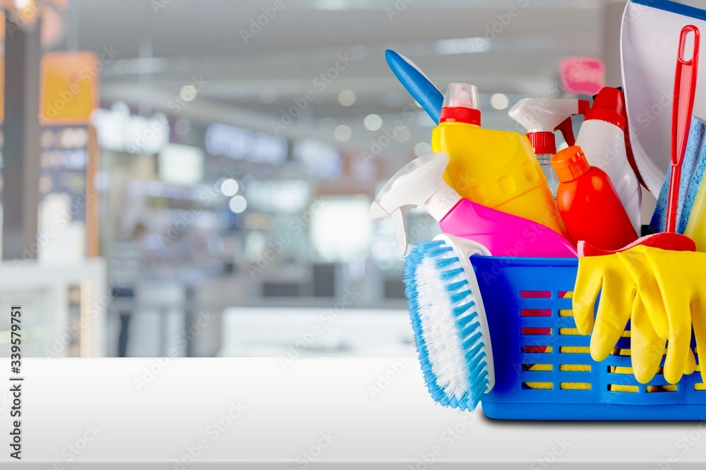 Plastic bottles, cleaning sponges and gloves  on background