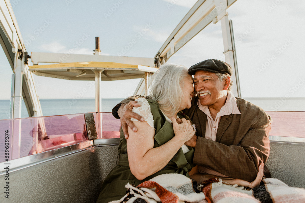 Happy senior couple on a Ferris wheel