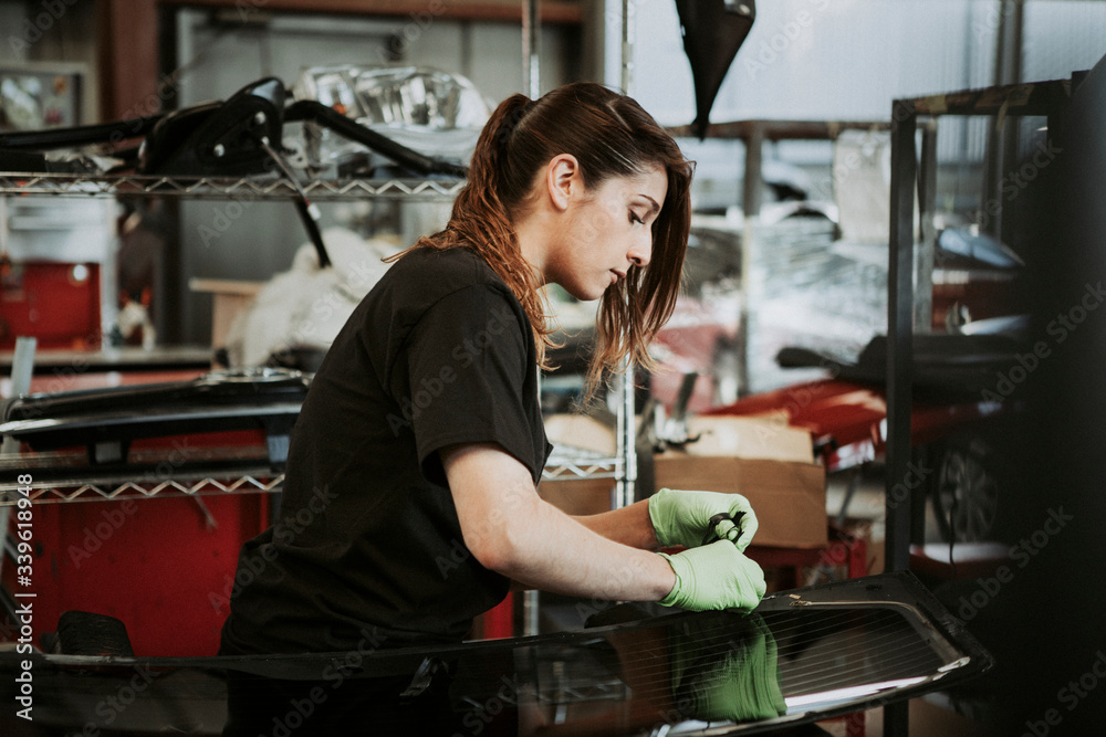 Female car mechanic at work