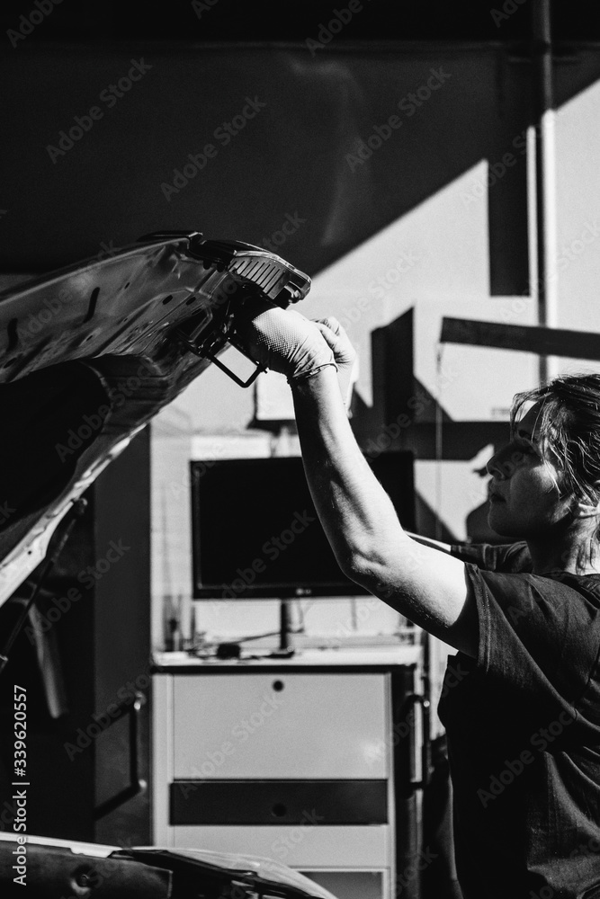 Female mechanic at a garage