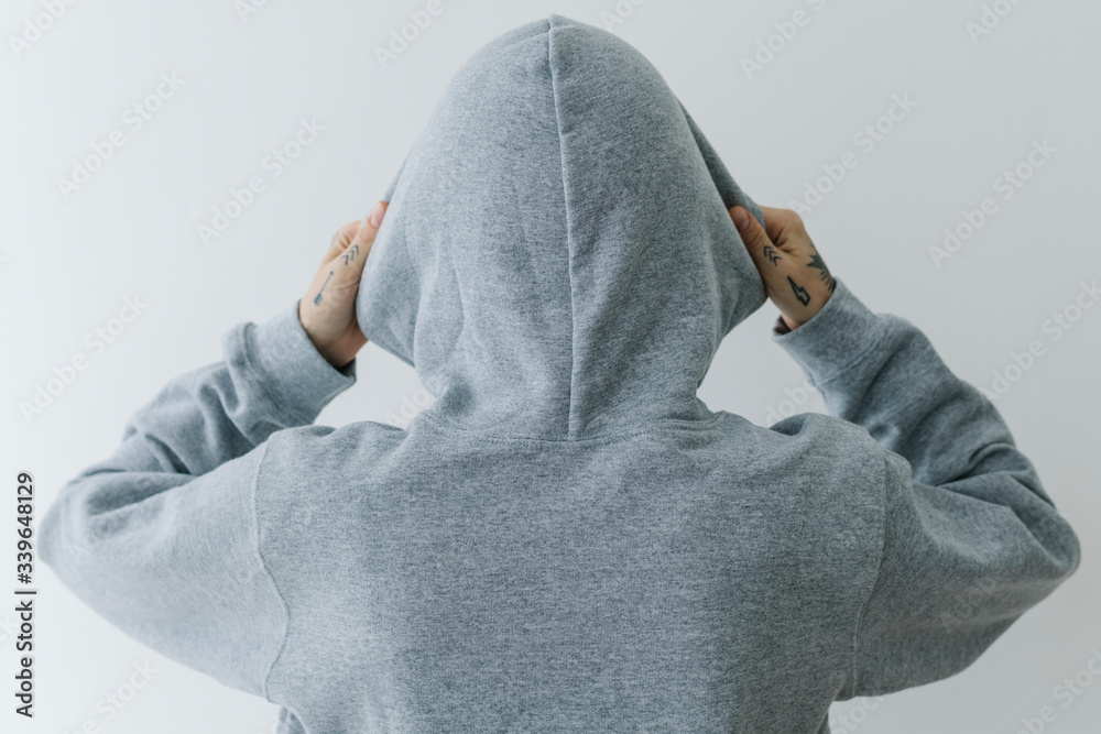 Model wearing gray hoodie