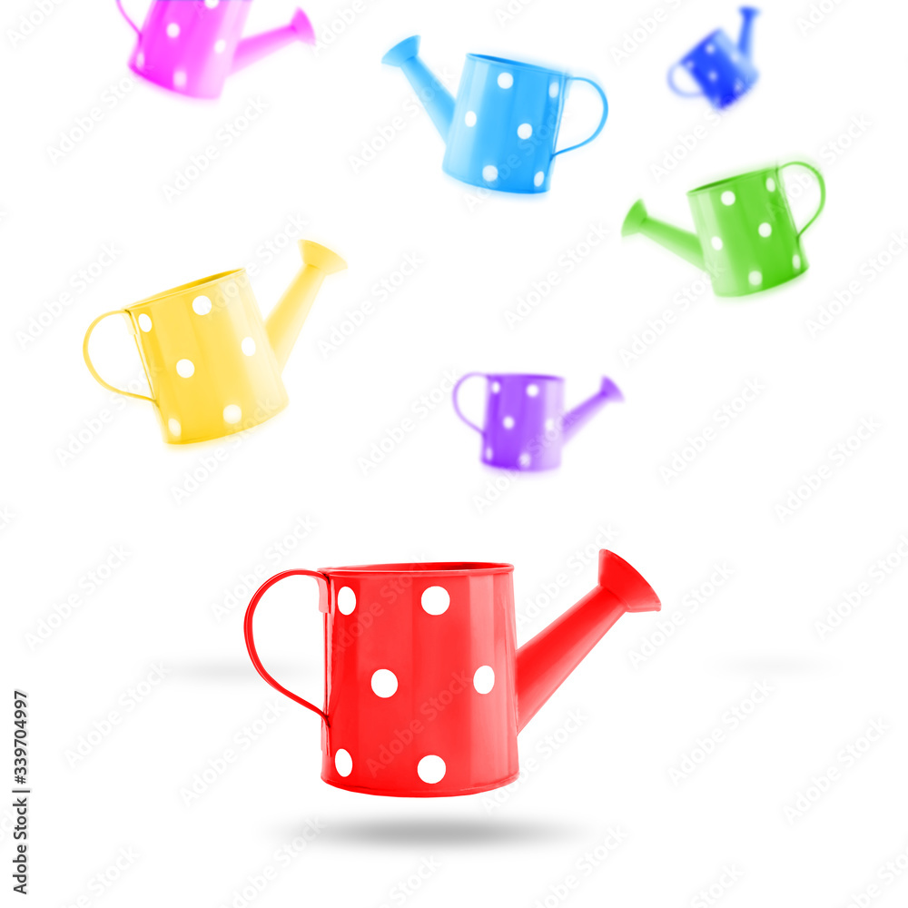 Flying watering cans for gardening on white background