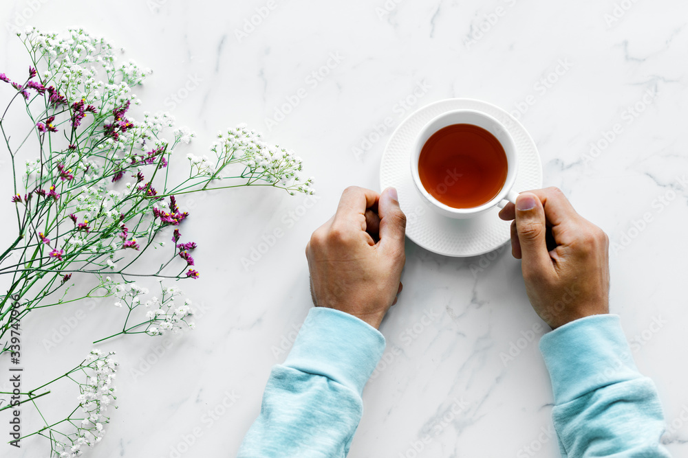 Aerial view of man with a hot cup of tea