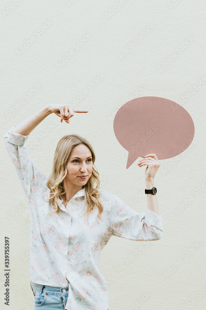 Woman holding speech bubble