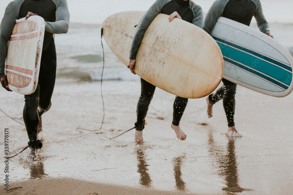 Surfers going into the water