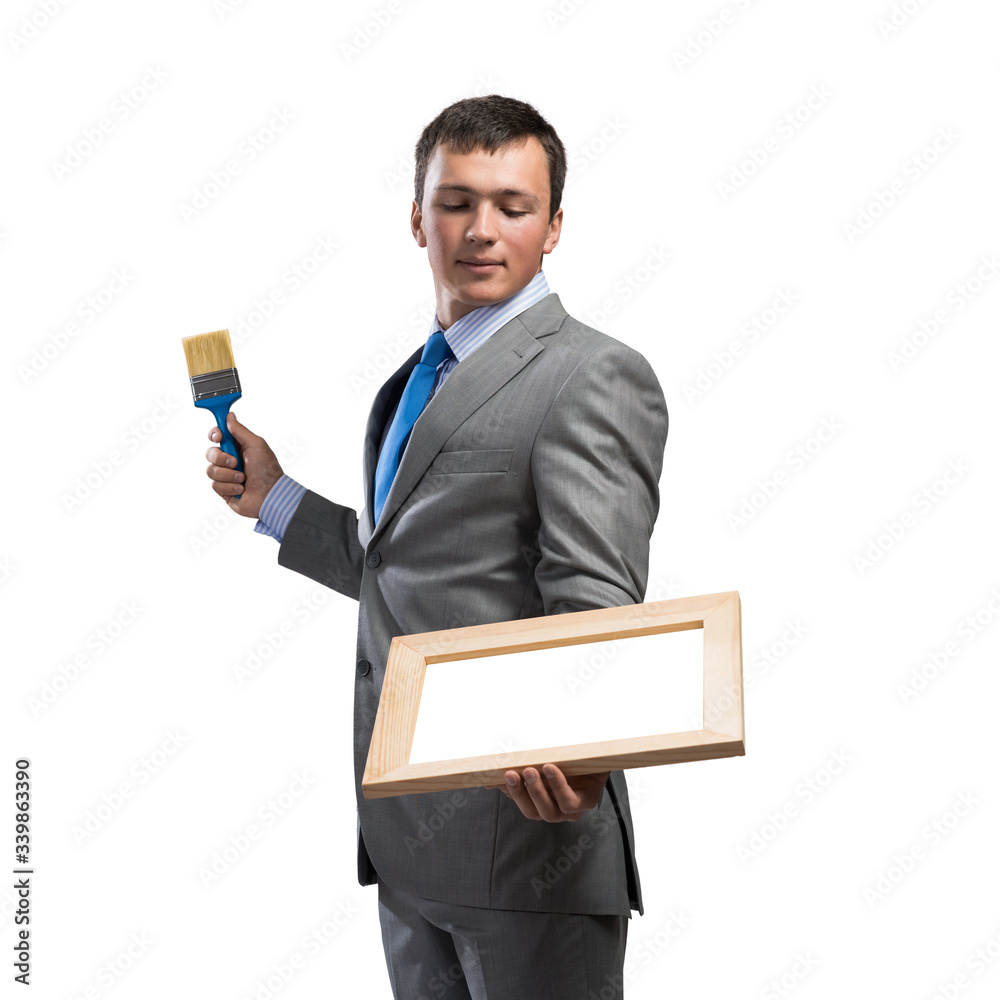 Creative businessman painter holding paintbrush