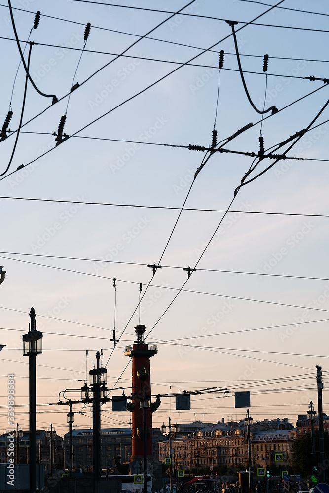 Photo in St. Petersburg against the sky, tram wires and architecture, sunset sky and it is painted i