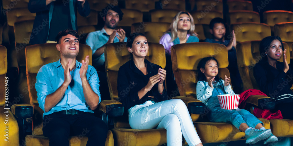 Group of audience happy and fun watch cinema in movie theater. Group recreation activity and enterta