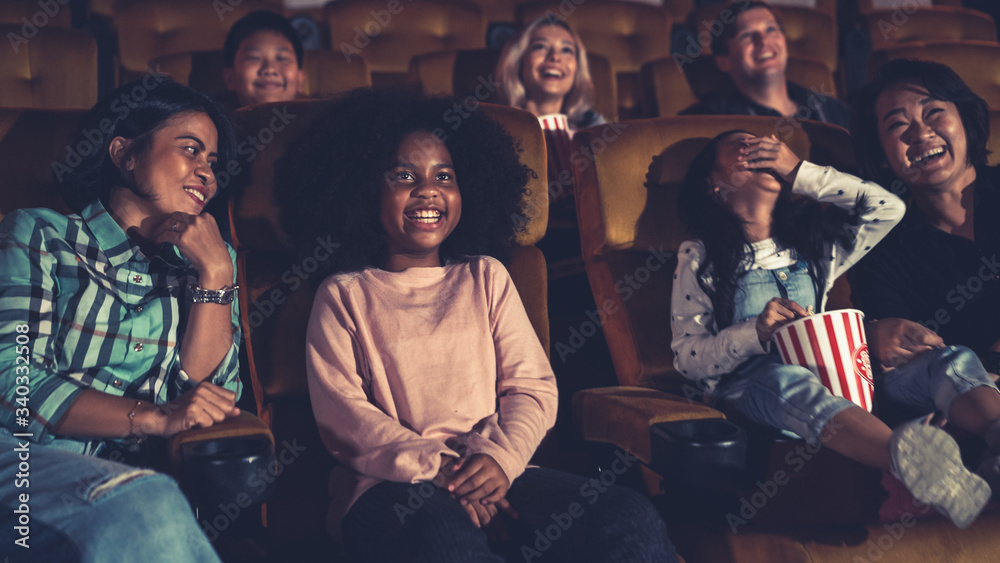 People audience watching movie in the movie theater cinema. Group recreation activity and entertainm