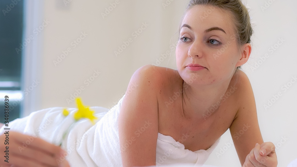 Two women at massage room having conversation in luxury day spa. Wellness, leisure and healthcare co