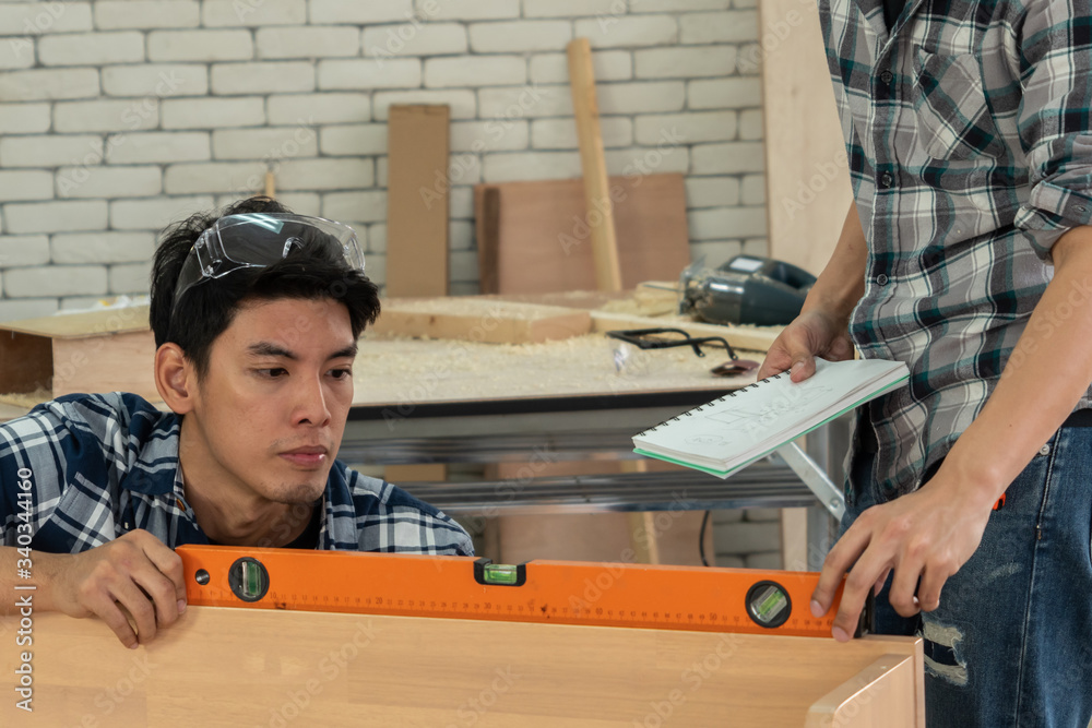 Carpenter working on wood craft at workshop to produce construction material or wooden furniture. Th