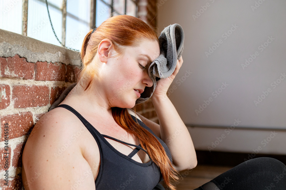 Woman wiping her sweat