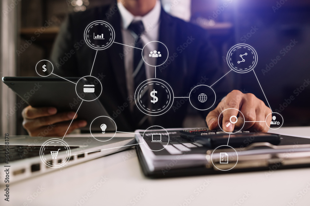  Businessman working with smart phone and laptop and digital tablet computer in  office with digital