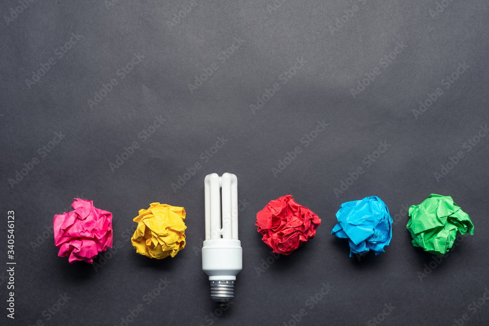 Fluorescent lamp and crumpled colorful paper balls