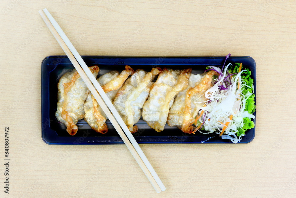 Fried Gyoza, Japanese dish consisting of wonton wrappers stuffed with pork and cabbage, eat with soy