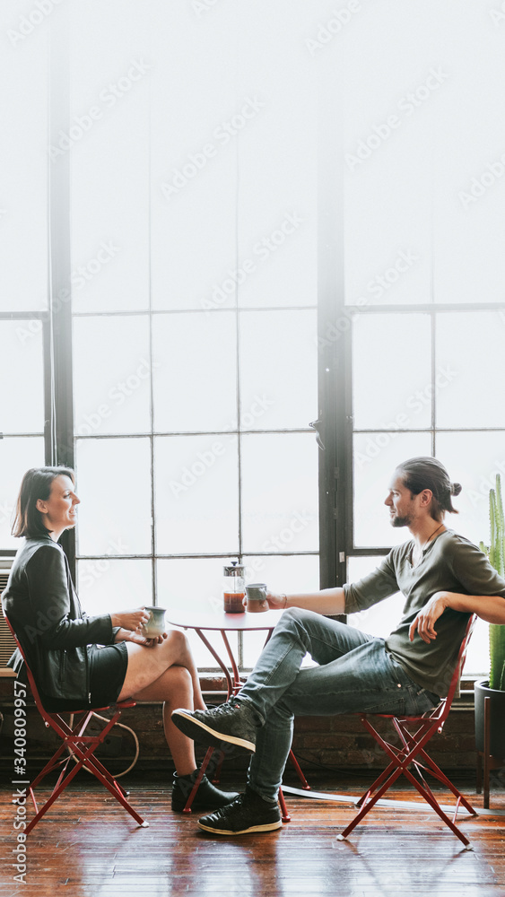 Lovely couple drinking coffee together