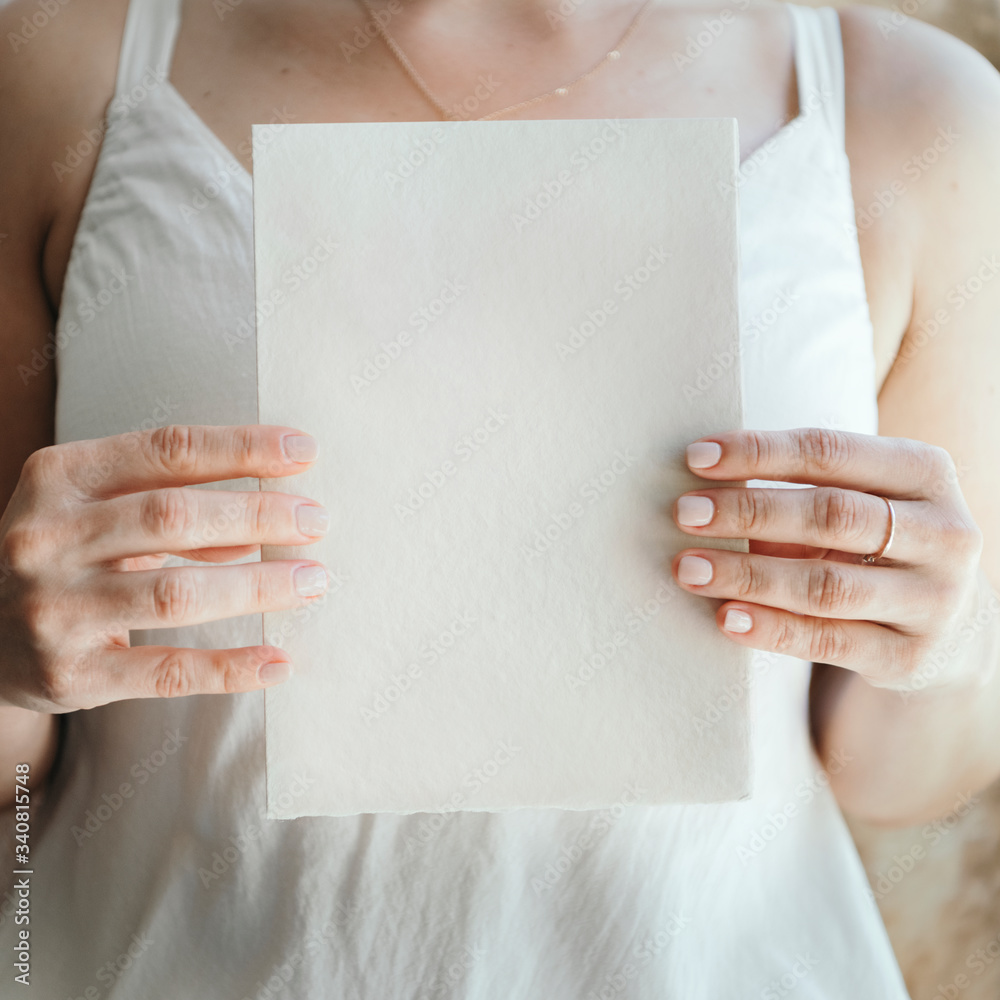 Woman holding a card