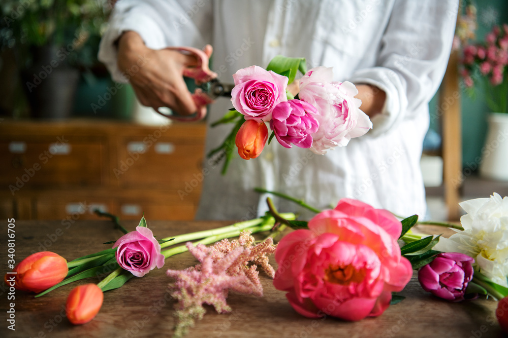 Woman arranging flowers