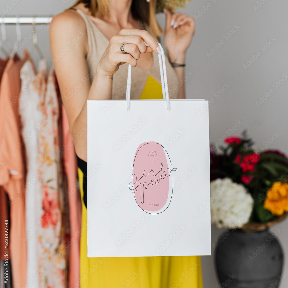 Woman carrying a paper bag