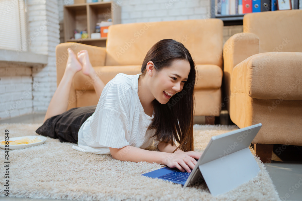 Asian women using computers work at home