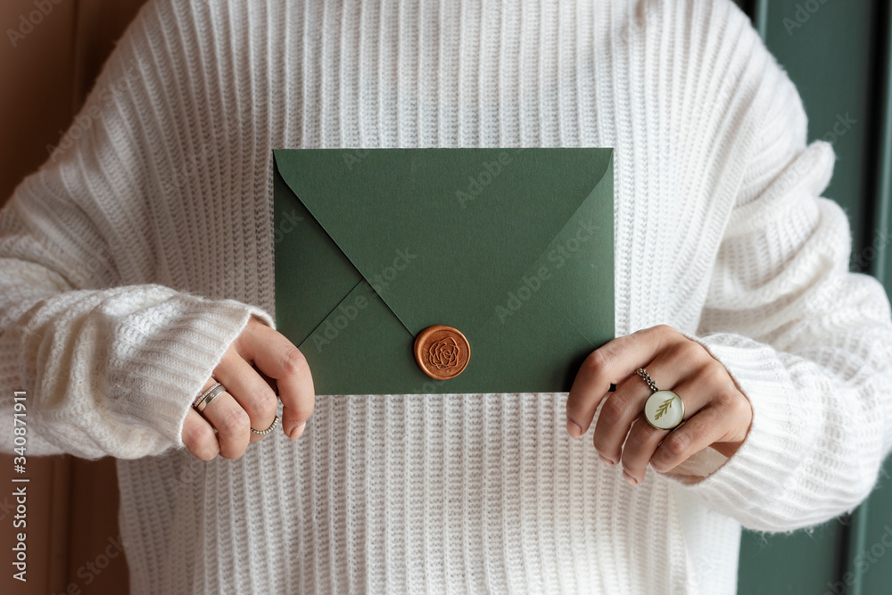 Woman holding an envelope