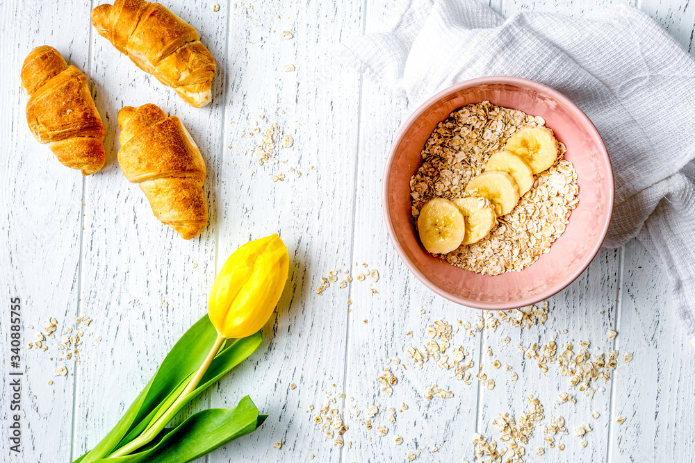 healthy breakfast with porridge on wooden background top view