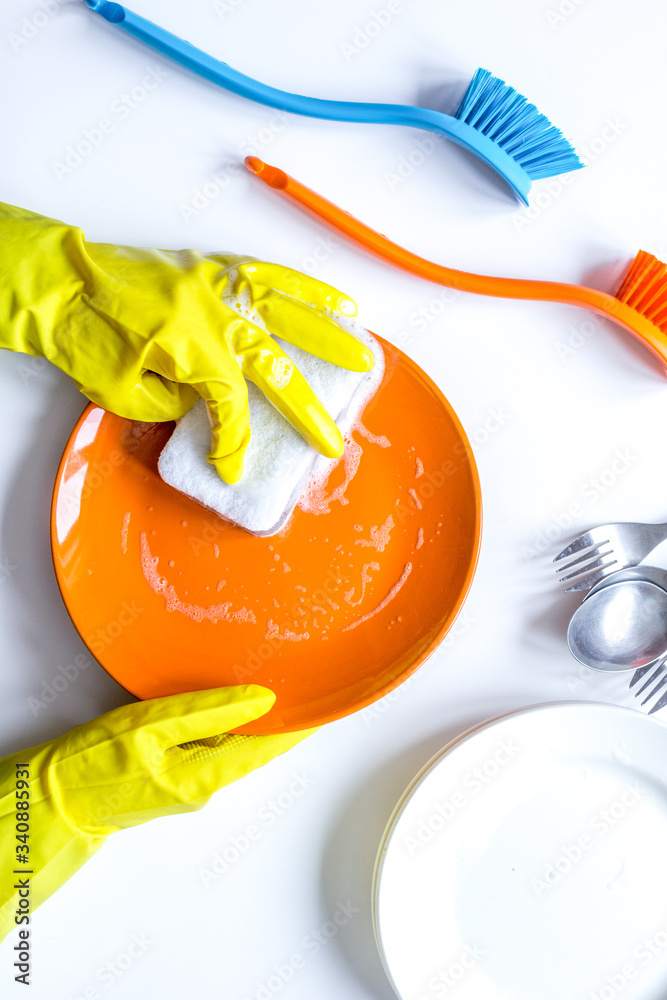 concept of woman washing dishes on white background