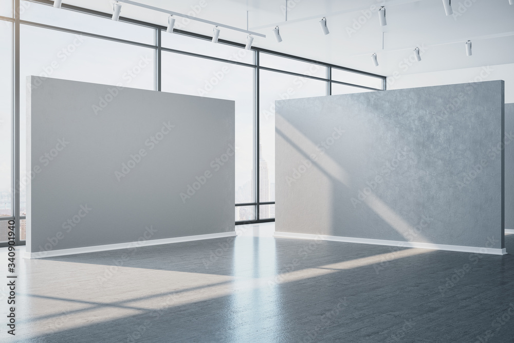 Modern gray gallery interior with empty wall