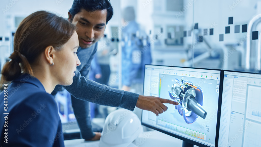 Modern Factory Office: Portrait of Male Project Supervisor Talking with a Female Industrial Engineer