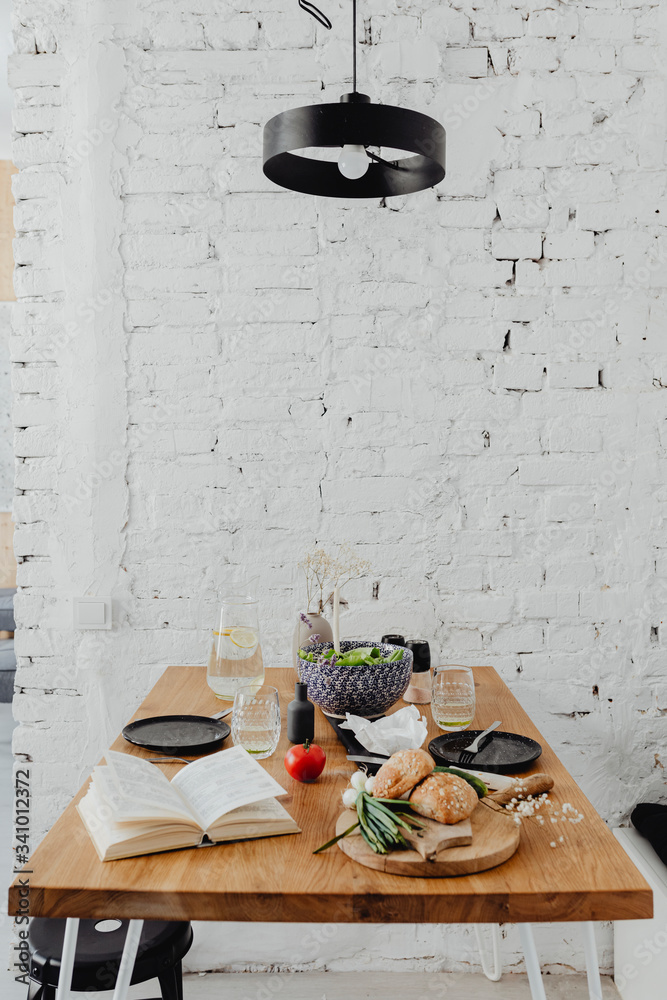 Minimal dining table with a cookbook