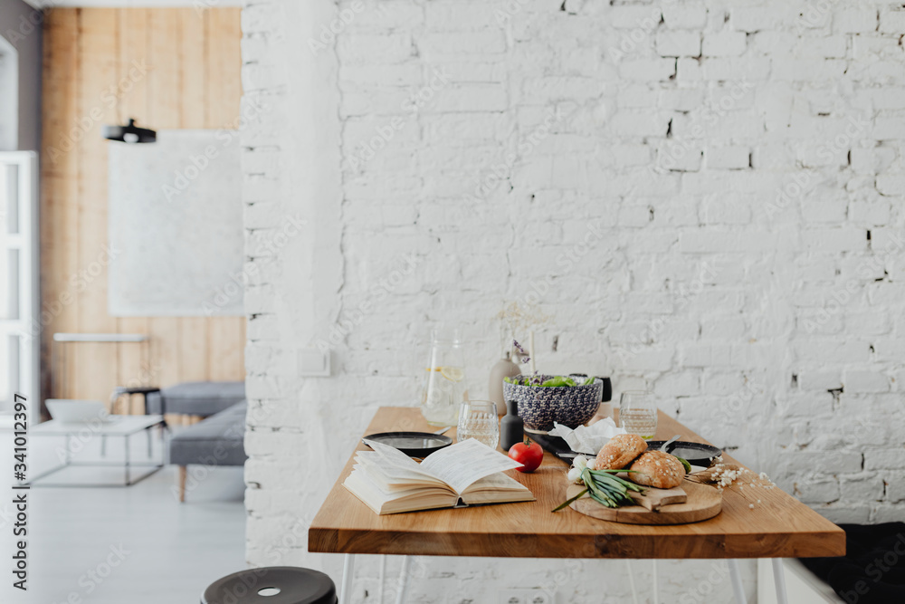 Minimal dining table with a cookbook