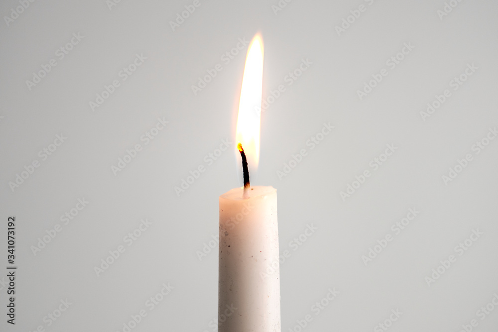 Lit candle stick