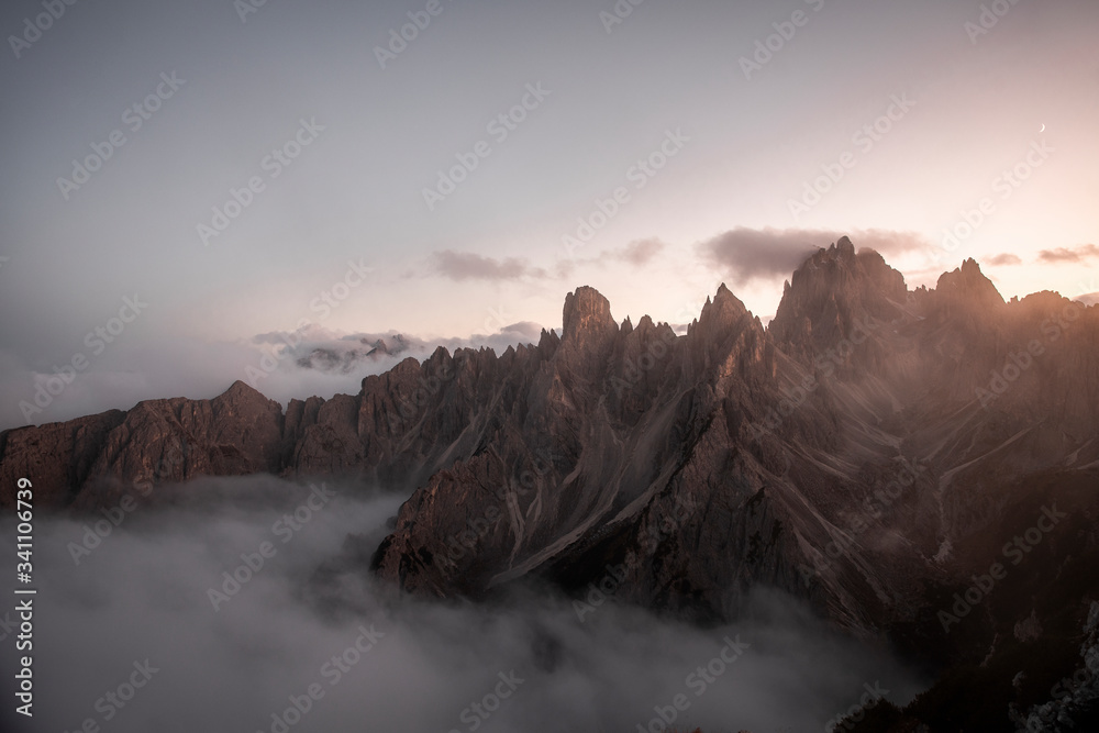 Misty mountain peak in Dolomites Italy