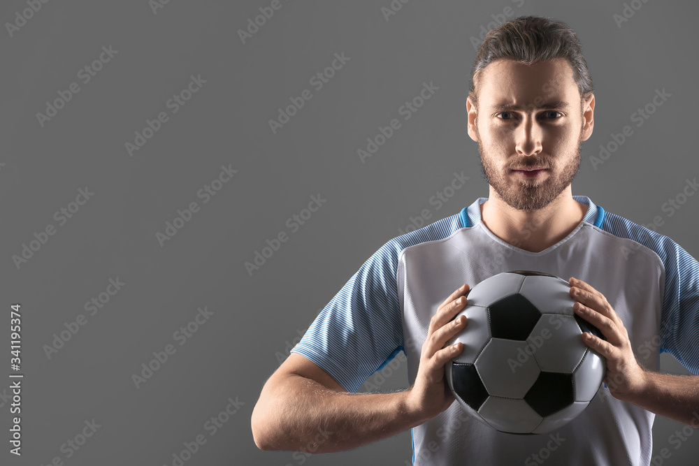 Silhouette of male football player on dark background