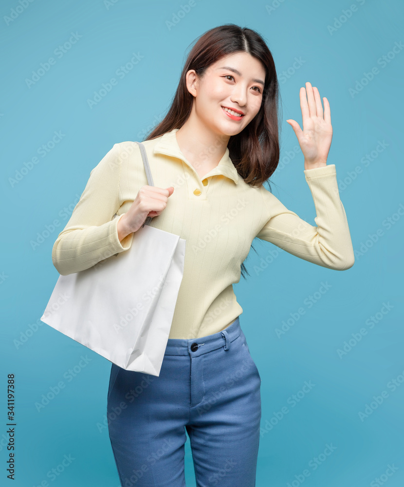 Asian girl on blue background

