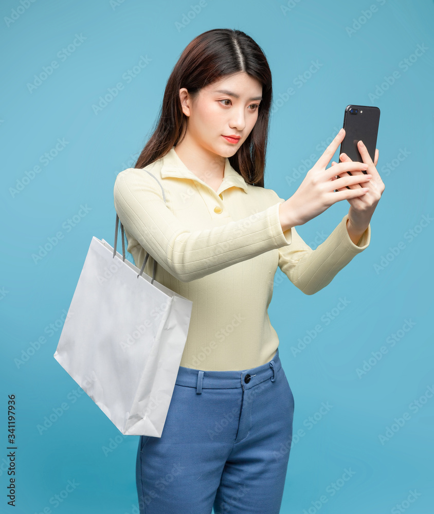 Asian girl on blue background

