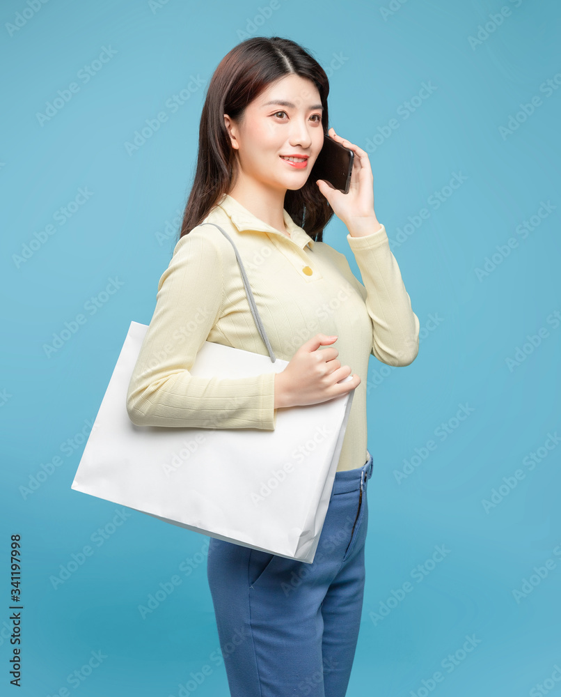 Asian girl on blue background

